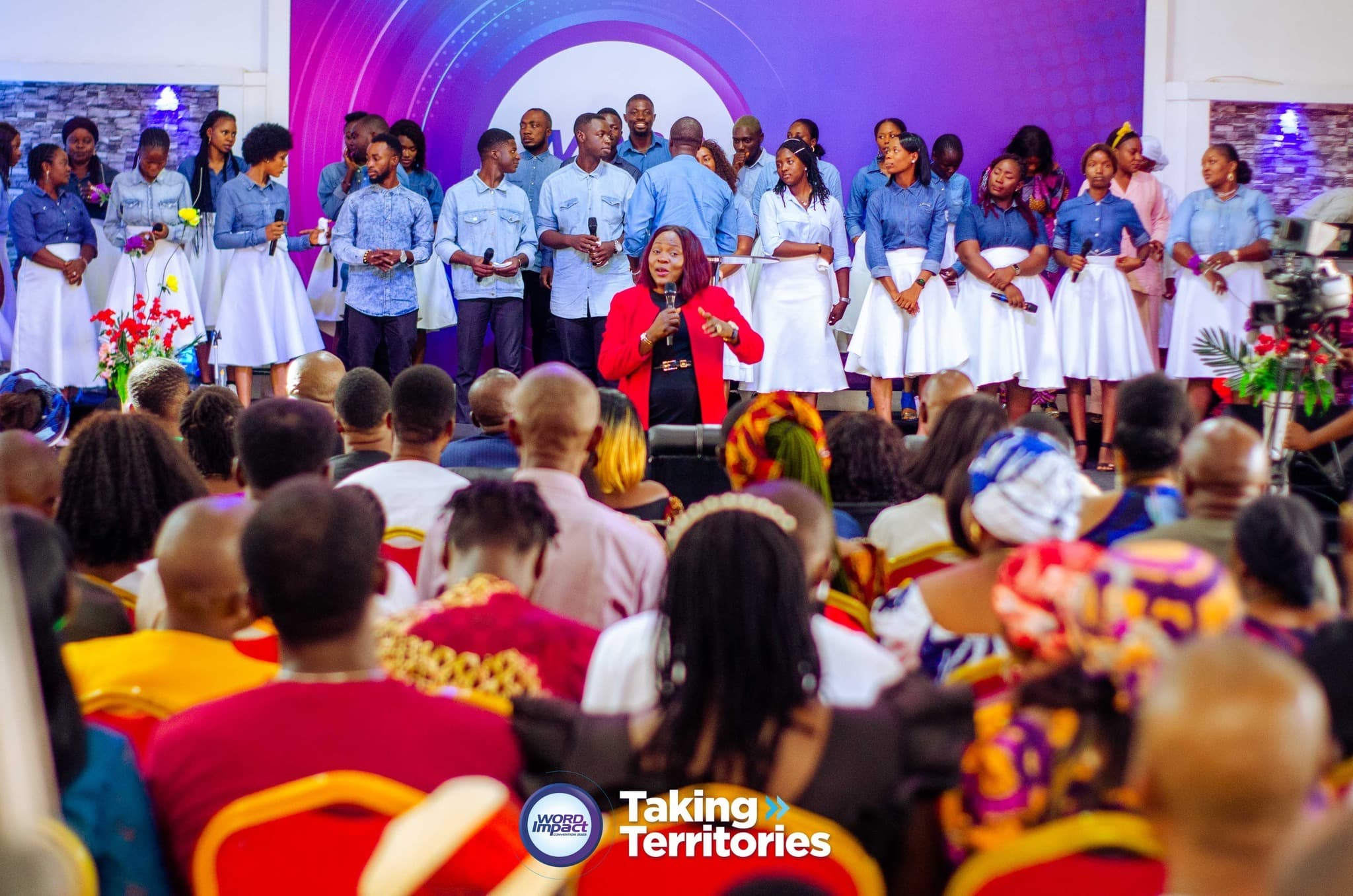 A minister preaching to a full hall