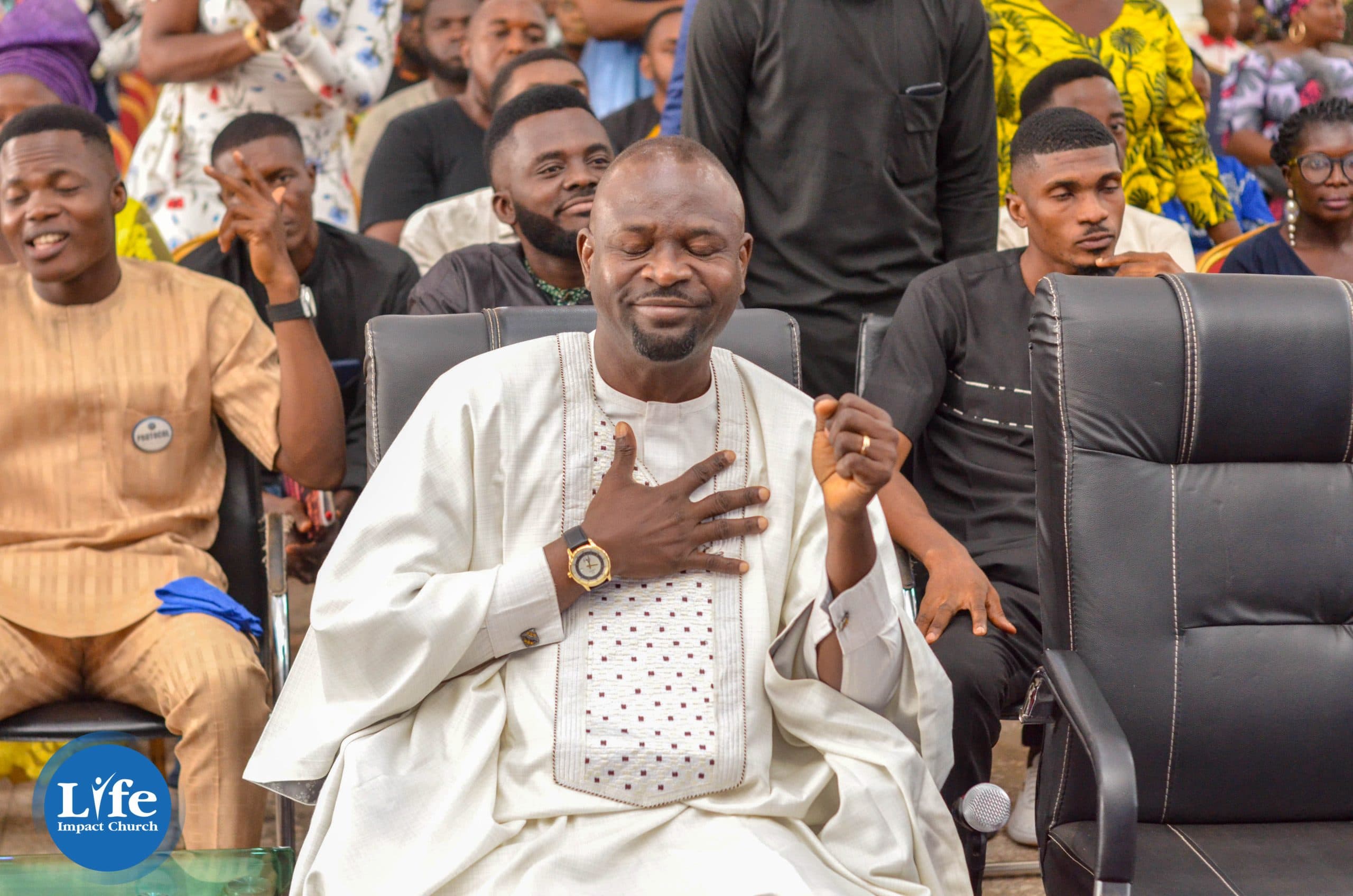 A member of the church with his hand on his heart